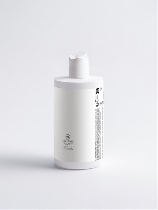 White bottle with a pump on a light gray background. This conditioner nourishes and protects hair ends to prevent breakage and split ends. It makes hair smoother, easier to style, and adds volume. Suitable for all hair types, it includes a refreshing Citrus Cocktail.