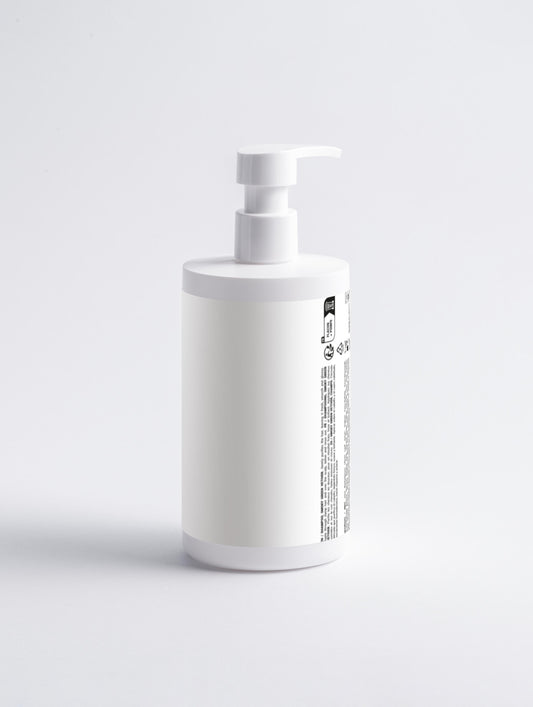 White bottle with pump dispenser on a light gray background. Vetiver Gloss Shampoo gently cleanses and nourishes hair, leaving it smooth, shiny, and healthy. With vetiver oil, glycerin, and squalane, it adds moisture, strengthens hair, and soothes the scalp. Suitable for all skin types.
