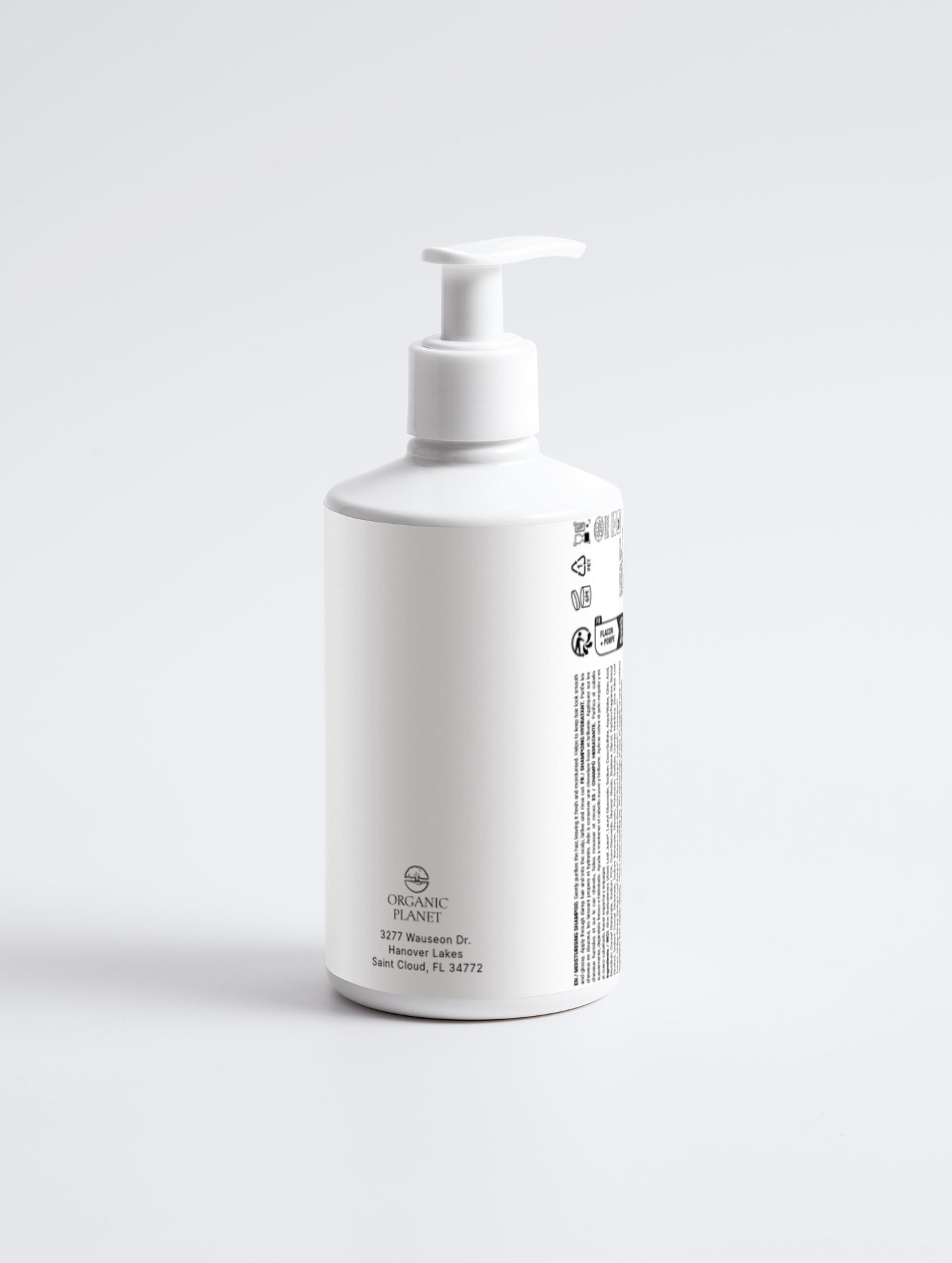 White bottle with pump on a light gray background