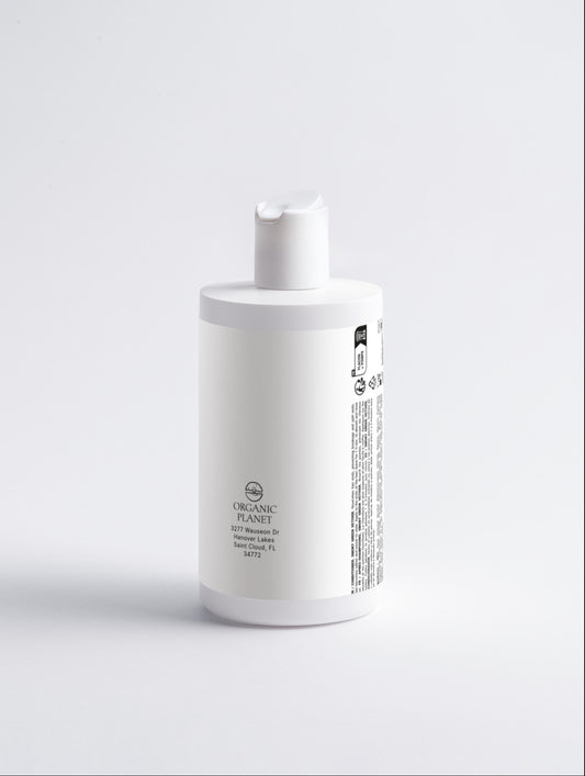 White bottle with a label on a light gray background