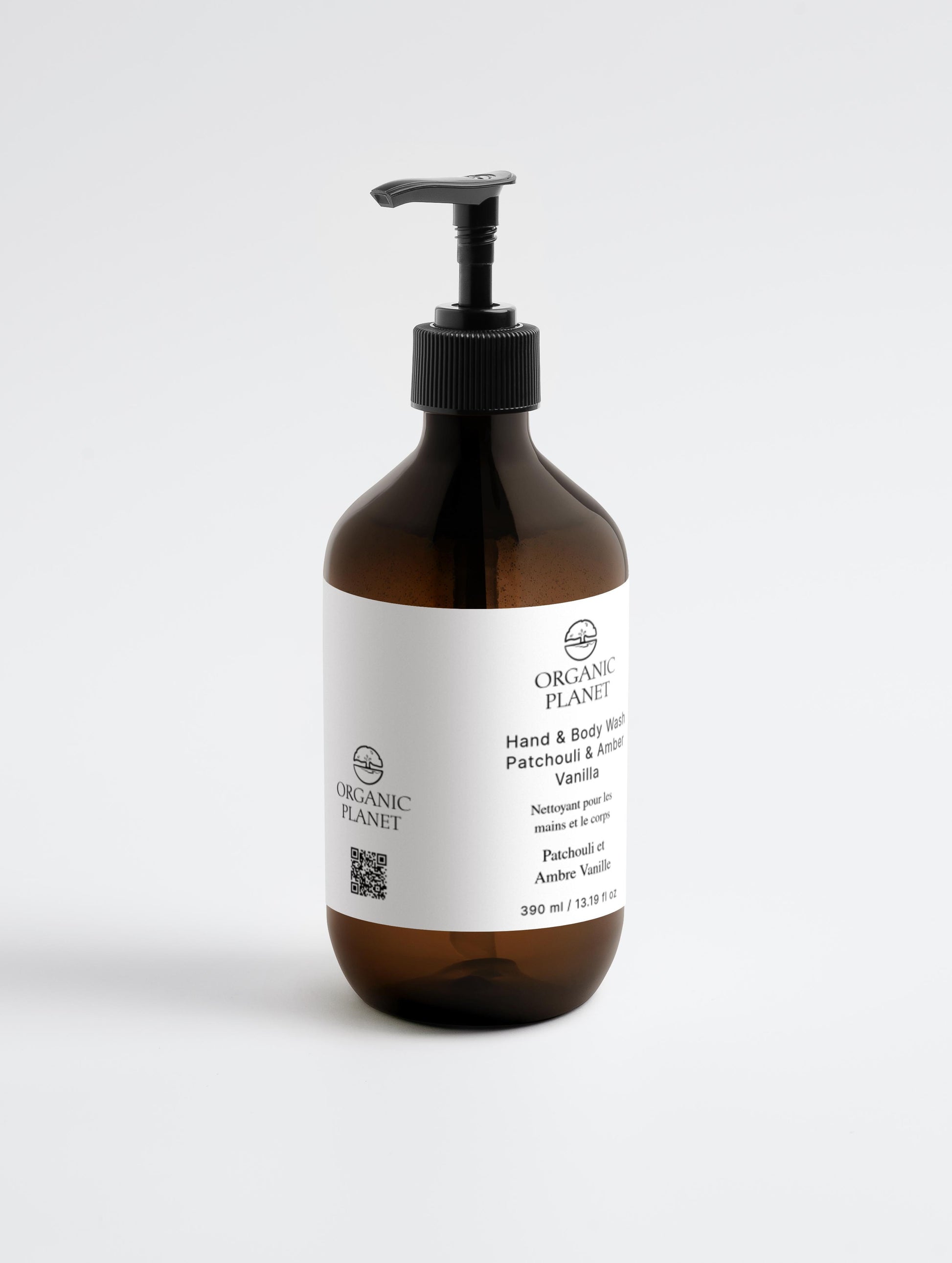 Hand and Body Wash, Patchouli & Vanilla. Brown bottle with pump and white label on a light gray background