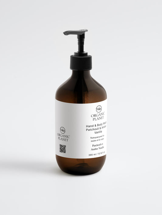 Hand and Body Wash, Patchouli & Vanilla. Brown bottle with pump and white label on a light gray background